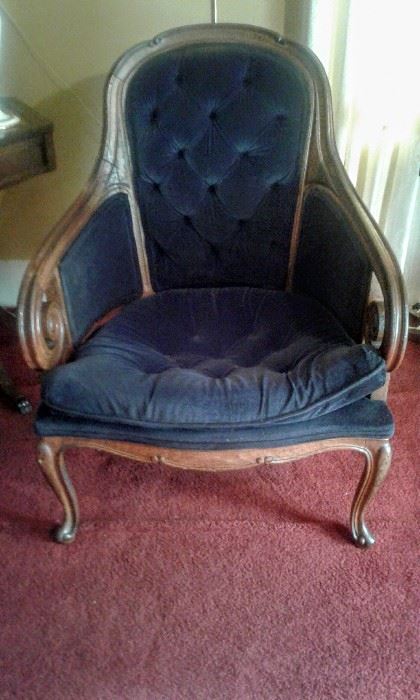 Lovely antique chair with scrolled arms.