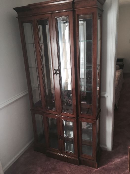Lighted, mirrored curio cabinet 