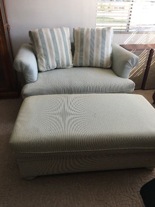 Green ticking stripe loveseat with twin sleep sofa.  Good condition.  With two throw pillows  Ottoman has storage under cusion.