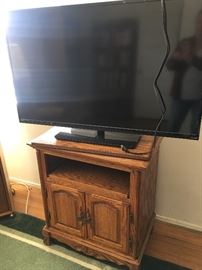 48" vizier flat screen television.  Oak tv stand with swivel top and storage.