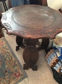 Nice antique side table with carved base.