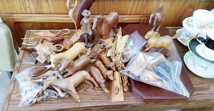 collection of handcarved wooden horses