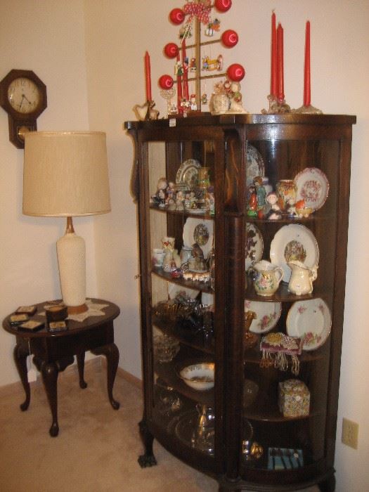 Antique curved glass-front display cabinet, Queen Anne end table, retro table lamp