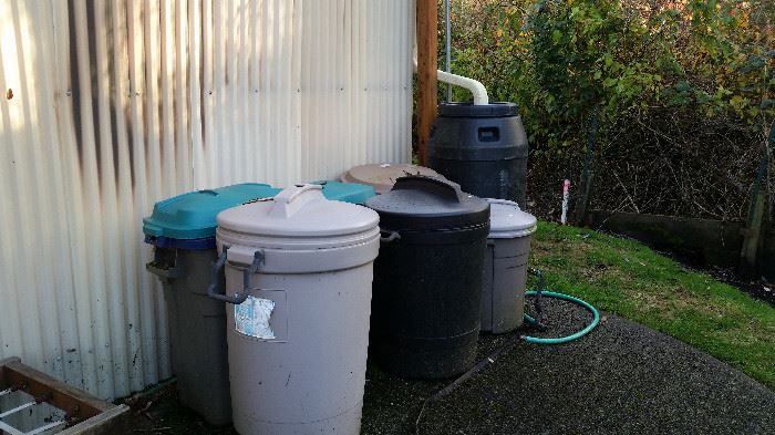 Garbage cans and water barrel