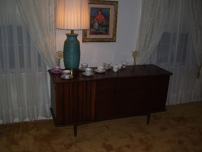 mid century buffet and pottery lamp.