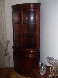 Just the right size mahogany corner china cabinet. 