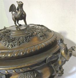 Lidded and adorned with griffins