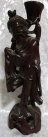 Wood carved oriental statue
