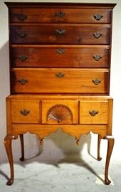 Dovetailed early fan carved highboy