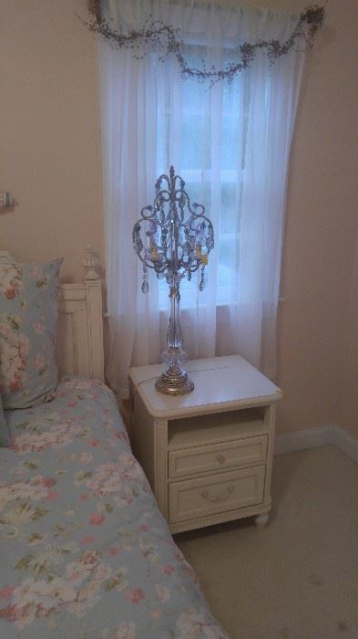 bedroom side table with ornate lamp