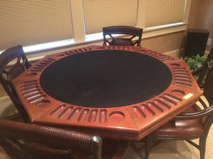 Oak game table with 4-chairs. Table has surface for playing cards as well as bumper pool underneath. This table was originally purchased from the comedian Louie Anderson. How Cool!