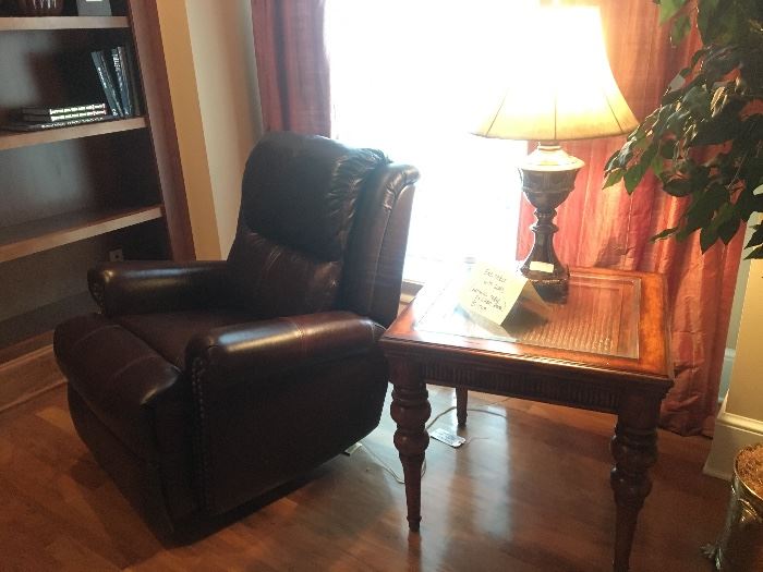 Comfortable leather recliner, table lamp and end table (matches coffee table in living room which is pictured later)