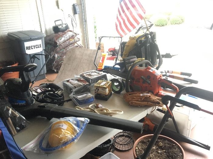 Corded blower, Husqvarna chainsaw, bags of mulch