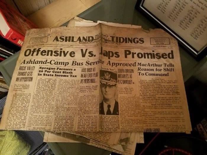 Several old newspapers with significant stories of our times. 