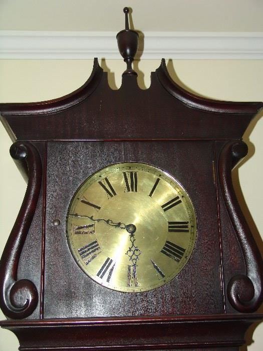 Brass face of tall case clock