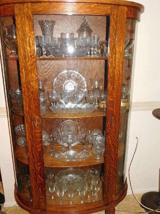 china cabinet filled with glass and crystal