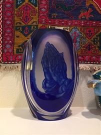 Praying hands on cobalt vase