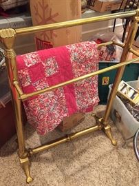 Bedspread caddy with brass scroll design.  