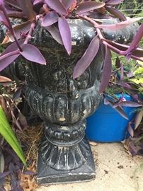 Urn with Bleeding heart perennial pink flowers plant growing. It will live thru the winter. 