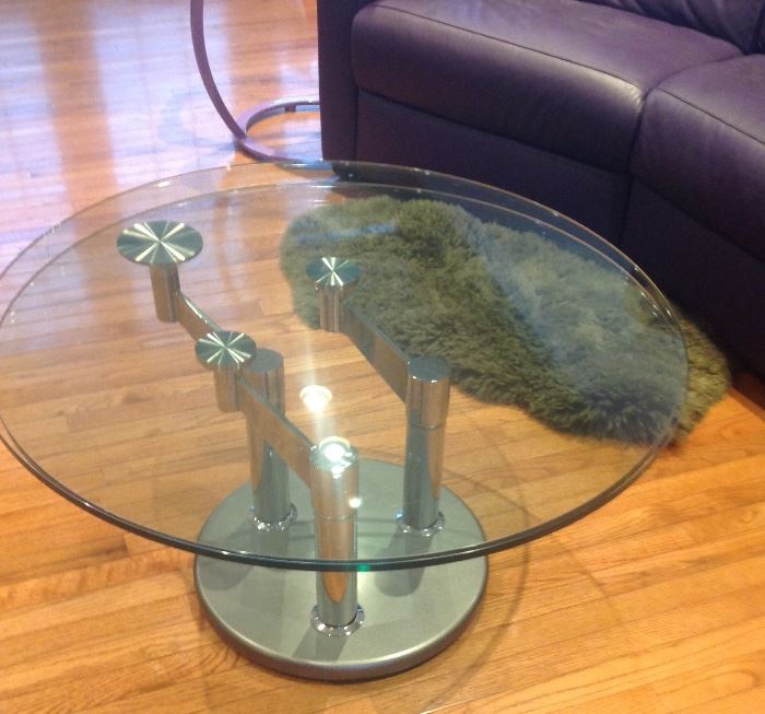 Glass top chrome base cocktail table