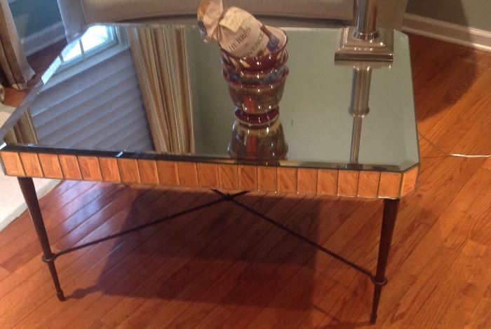 Mirrored cocktail table with iron base