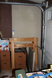 SEWING MATERIAL TABLE, ITS THE TALL PIECE BEHIND THE SAW HORSES.  ITS 4'X8' AND SITS ON TOP OF THE SAW HORSES.