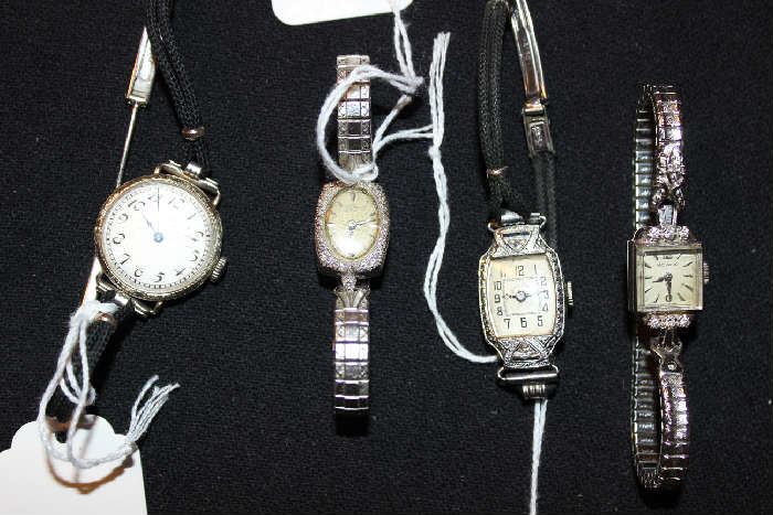 LEFT TO RIGHT-- ELGIN,--- 14K WITH DIAM-MELLA,---OLOEDORFF,--- MOVADO WITH DIAMONDS INSCRIBED JACOB JEWELERS 1959