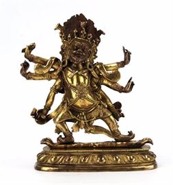 9. BRONZE HAYAGRIVA FIGURE铜鎏金六臂金刚佛造像A bronze figure of Hayagriva wearing a skull crown on a lotus base. H: 7 1/8 in W: 6 1/4 in
