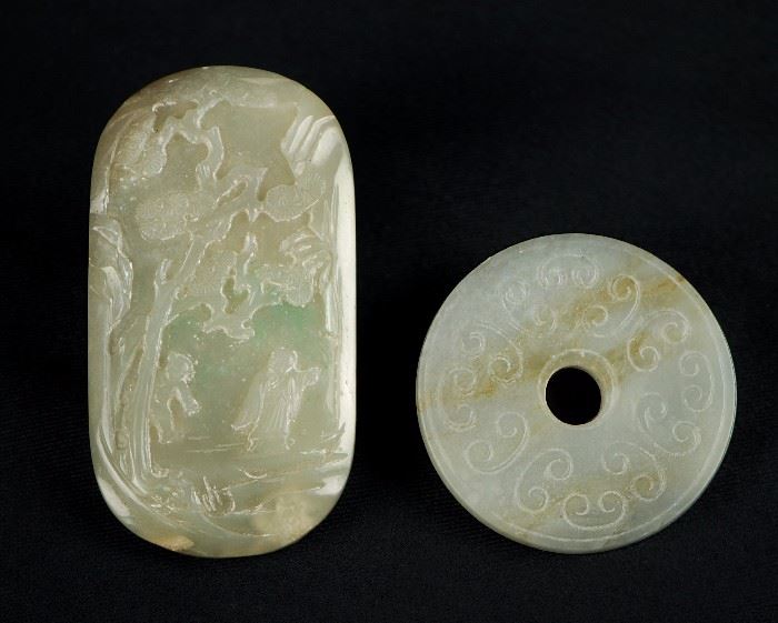 22. JADE PAIR BI DISC AND PLAQUE 青白玉雕人物山水玉珮一對A bi disk with cloud patterns and a thin piece of jade carved with a figural scene in shallow relief. 83g
H: 2in W: 3 1/4in

