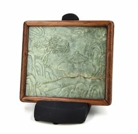 37. QING DYNASTY (1616-1912)  HUANGHUALI FRAMED JADE PLAQUE黃花梨框嵌青白玉擺件A jade plaque incised with scenic imagery on both faces.427g
L: 5in  W: 5 1/2in
