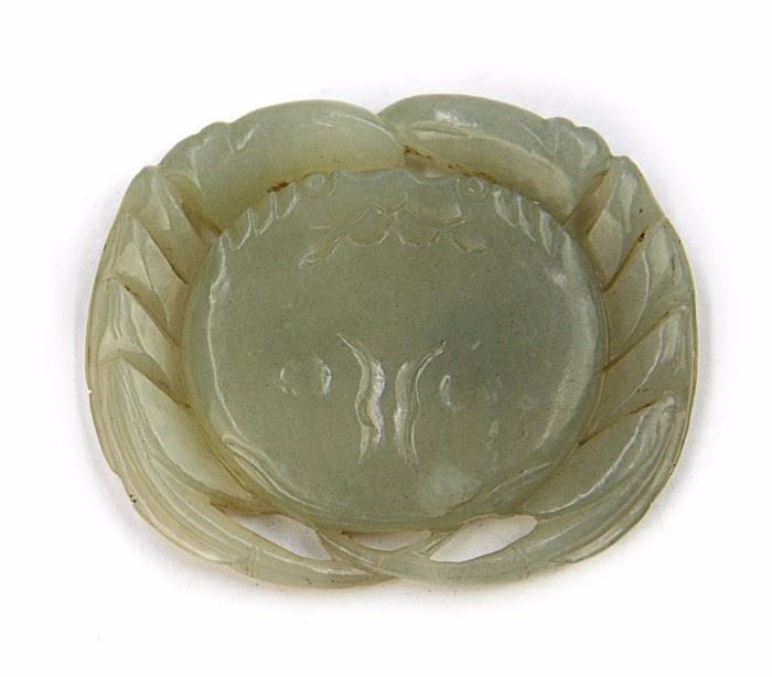 47. JADE CRAB TOGGLE青白玉佩A toggle in the shape of a crab, which is a symbol for foturne and power. 41g D:2 3/8in