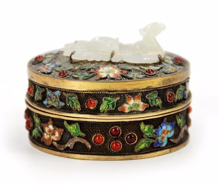 80. JADE PEACOCK TOPPED BOX掐絲琺瑯白玉蓋盒Accented with red stones, this small circular box is covered in enameled florals and a hade peacock on the lid. H:1 1/2in W:2 1/4in