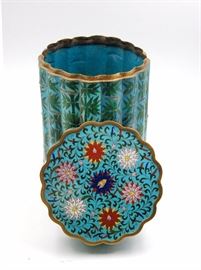 81. CLOISONNE BAMBOO CANISTER景泰藍竹紋瓜楞蓋罐With a ribbed design emulated the structure of bamboo, this cloisonne container has a bright turquoise blue body decorated with bamboo and floral patterns.H: 12 1/4 in   D: 8 in
