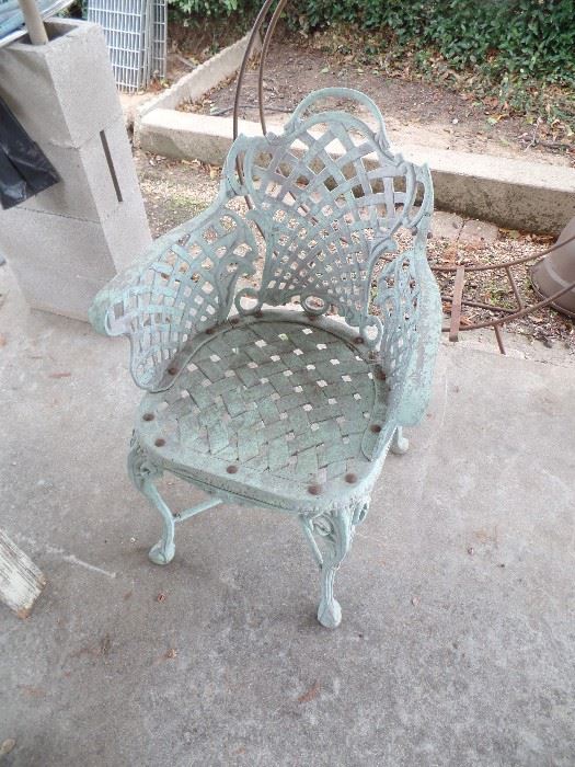 One (1) Heavy cast iron Patio Chair.