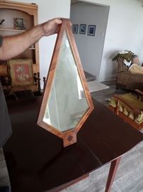 Interesting Mirror with an angular shape. Nice wood frame.