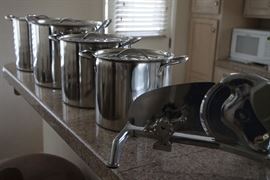 Set of Four lightweight Pots.  Electric meat cutter.
