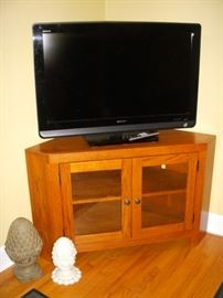 Oak corner TV stand, Sony flat screen TV, Decorative finials