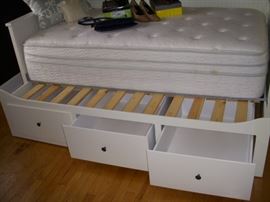 IKEA trundle showing trundle partially pulled-out.