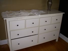 IKEA dresser displaying doilies