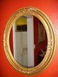 Gilt gesso oval mirror (losses to gilt)
