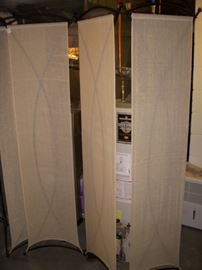 One of two iron folding screens with linen panels