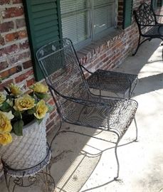 wrought iron tables, chairs, pottery flowers