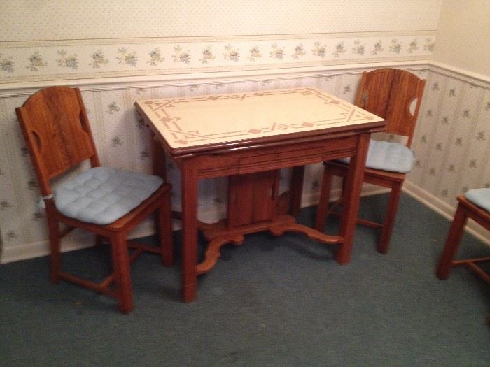 Neat Table with Self Storing Pullout Leaves and (3) Chairs 