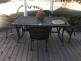 Outdoor dining table with chairs.