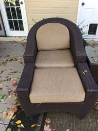 One of 2 club chairs and ottomans for the patio