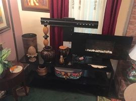 TV table, various jars and decor, electric heater