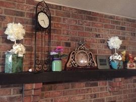 Clocks and turquoise pottery