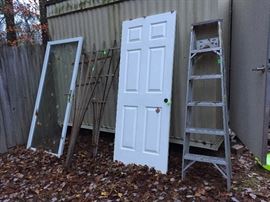 Glass door, trellis, wooden door & metal ladder