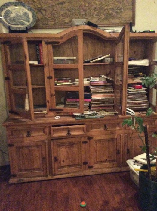Sugar knotty pine book shelves and storage cabinets.