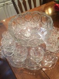 Punch bowl, underplate, cups, and ladle